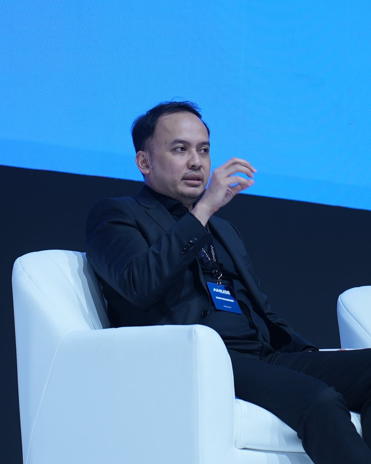 Dr. Danu speaking on a panel discussion at a medical congress
